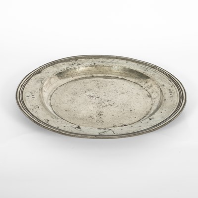 Lot 92 - An English pewter multiple reeded charger