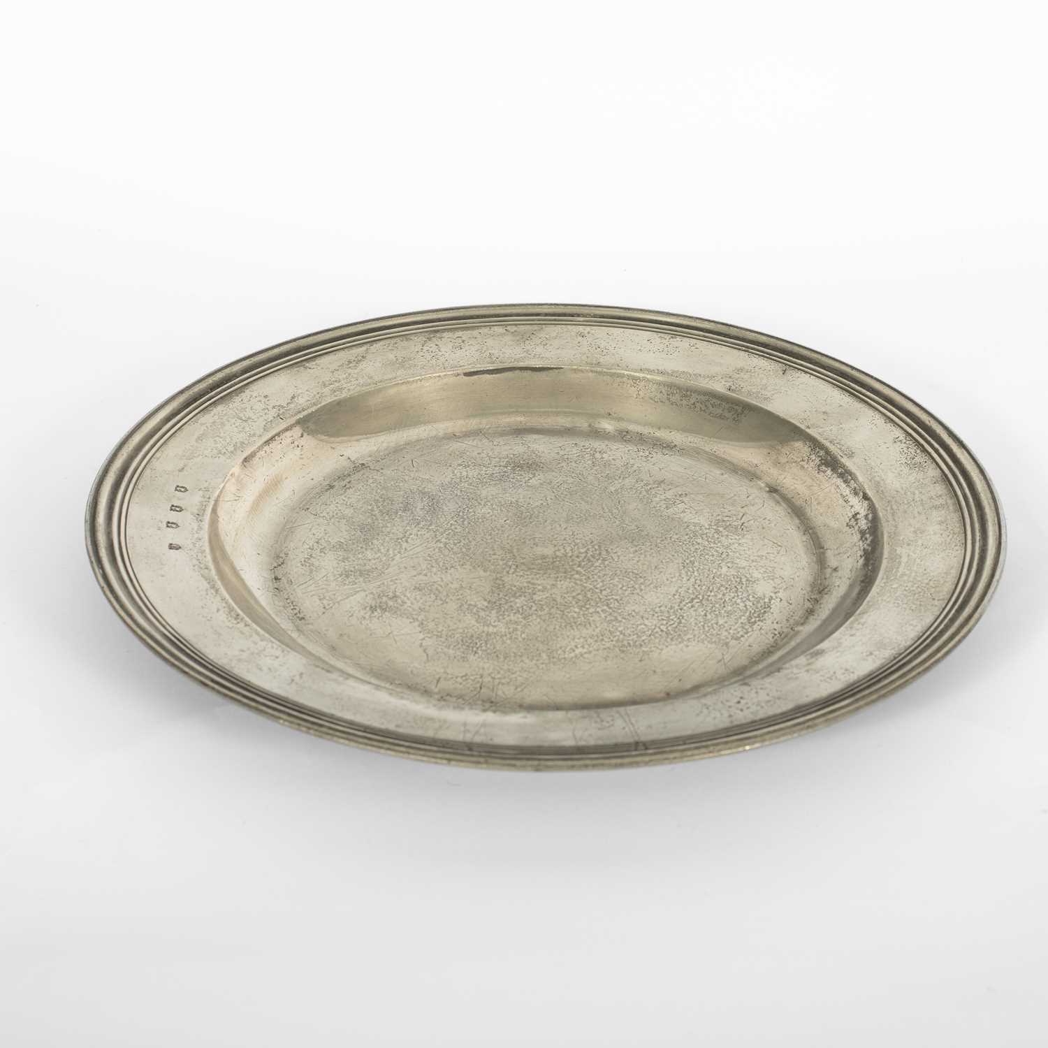 Lot 41 - An English pewter multiple reeded charger by John Barlow of London
