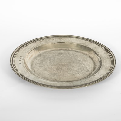 Lot 41 - An English pewter multiple reeded charger by John Barlow of London