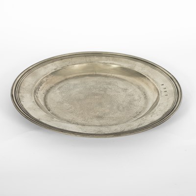 Lot 41 - An English pewter multiple reeded charger by John Barlow of London