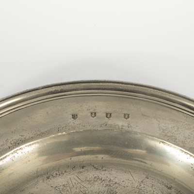 Lot 41 - An English pewter multiple reeded charger by John Barlow of London