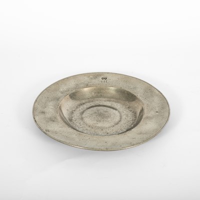 Lot 93 - A German pewter broad rim bossed dish