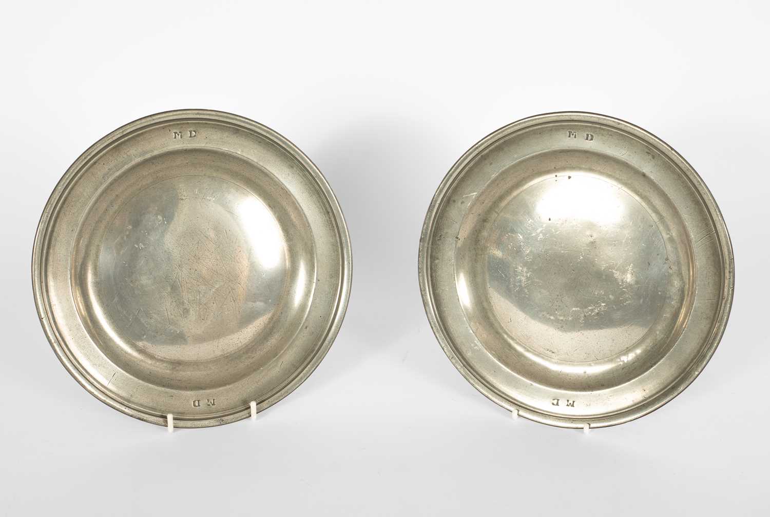 Lot 40 - A pair of English pewter reeded plates by Robert Jupe of London