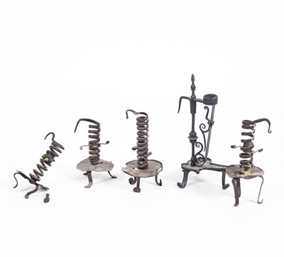 Lot 67 - Five wrought iron candlesticks
