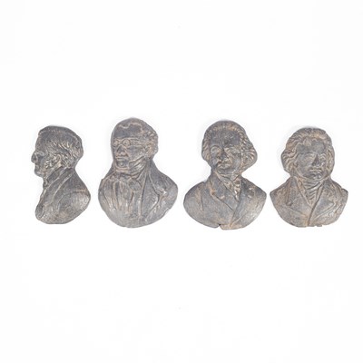 Lot 557 - Four relief cast lead portraits of composers