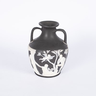 Lot 677 - A Wedgwood black jasperware replica of the Portland Vase
