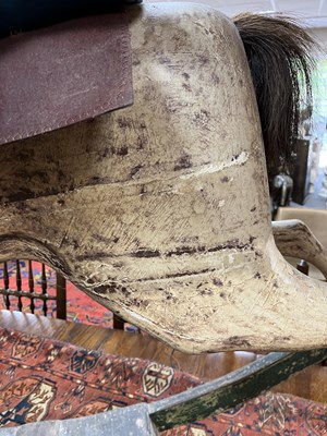 Lot 679 - An early carved and painted rocking horse