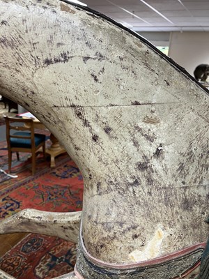 Lot 679 - An early carved and painted rocking horse