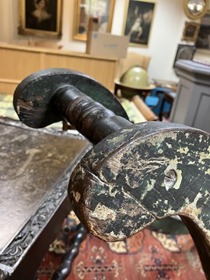 Lot 679 - An early carved and painted rocking horse