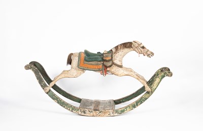 Lot 679 - An early carved and painted rocking horse