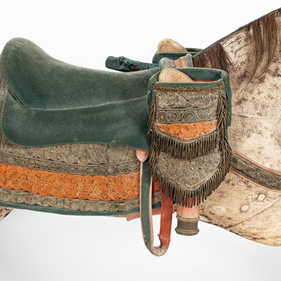 Lot 679 - An early carved and painted rocking horse