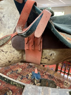 Lot 679 - An early carved and painted rocking horse