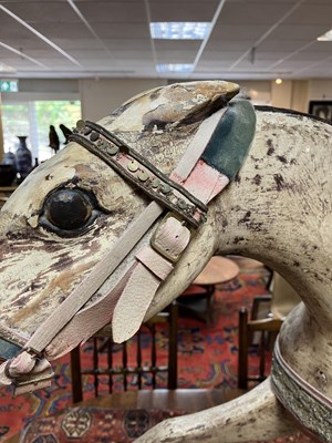 Lot 679 - An early carved and painted rocking horse
