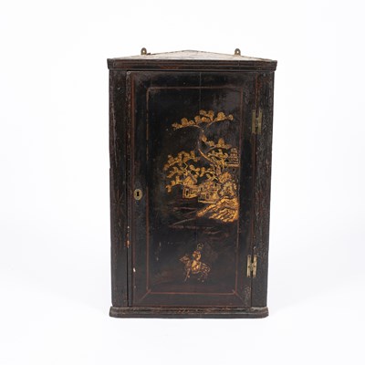 Lot 712 - A 19th Century black lacquered corner cupboard
