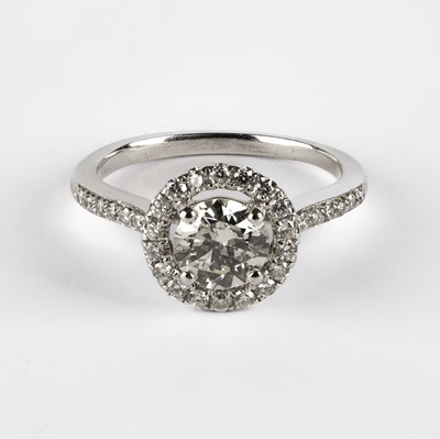 Lot A white metal diamond halo ring
