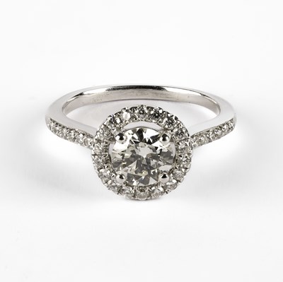 Lot 298 - A white metal diamond halo ring