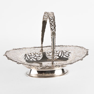 Lot 34 - An Edwardian silver swing-handled basket