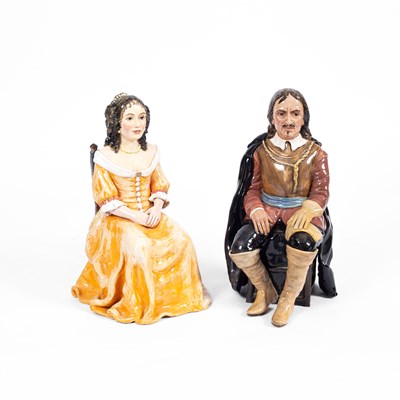 Lot 58 - A pair of ceramic seated figures of Oliver Cromwell and Catherine of Braganza