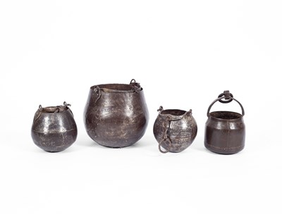 Lot 35 - Four hanging iron cooking pots