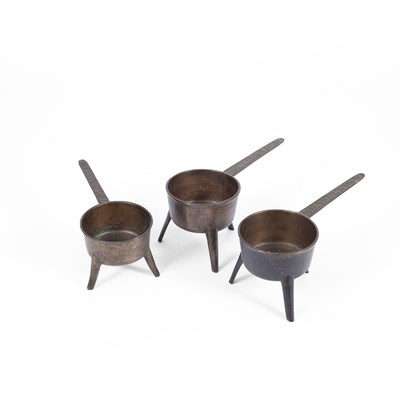 Lot 63 - Two lead bronze skillets