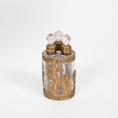 Lot 495 - A gilt metal mounted clear glass triple scent bottle