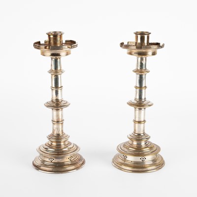 Lot 148 - A pair of silver plated candlesticks
