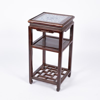 Lot 774 - A Chinese hardwood three-tier stand