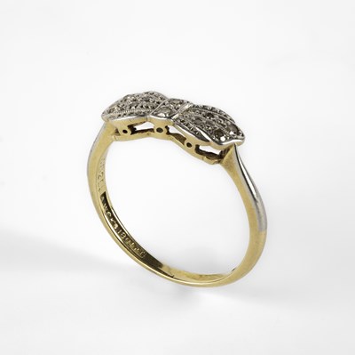 Lot 241 - An 18ct gold, platinum and diamond bow shaped cluster ring