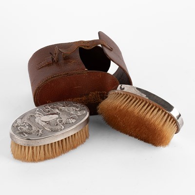 Lot 144 - A pair of Chinese export silver backed hair brushes