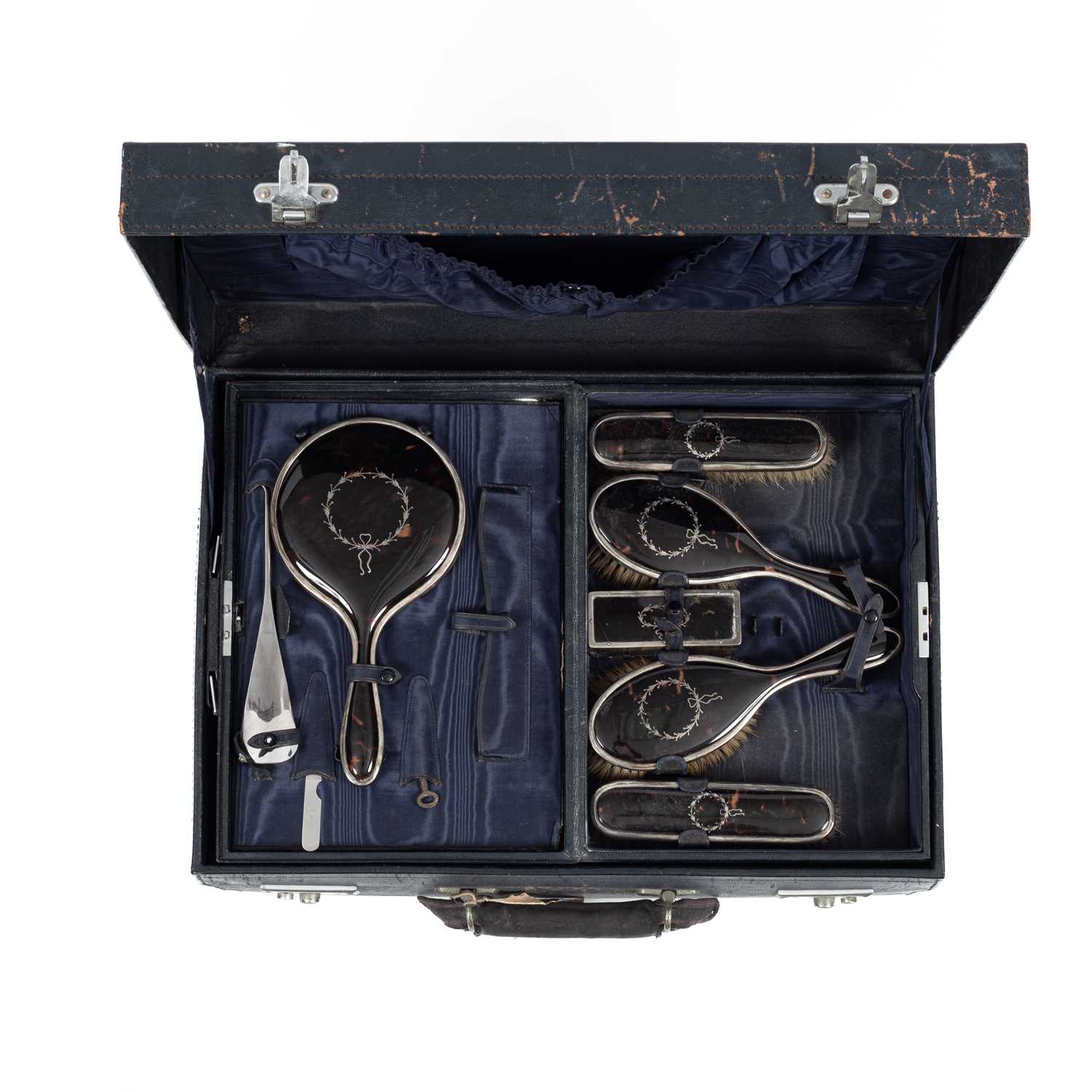 Lot 104 - A silver and tortoiseshell mounted silver dressing set