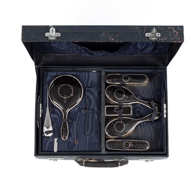 Lot 104 - A silver and tortoiseshell mounted silver dressing set