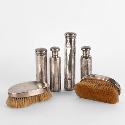 Lot 105 - A set of four Edwardian silver dressing case items