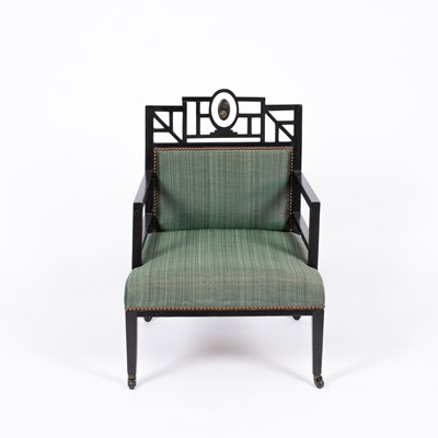 Lot 50 - An Aesthetic movement ebonised open armchair