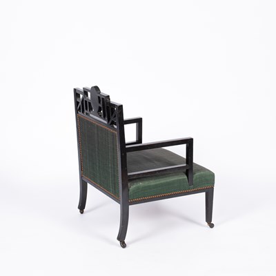 Lot 50 - An Aesthetic movement ebonised open armchair
