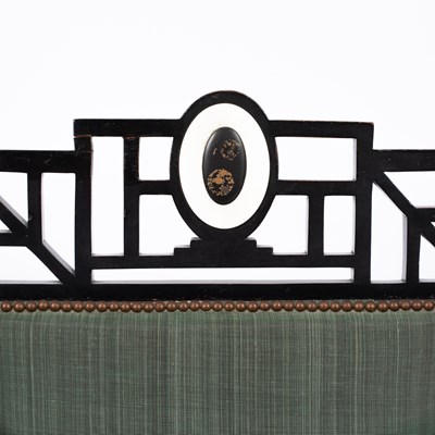 Lot 50 - An Aesthetic movement ebonised open armchair