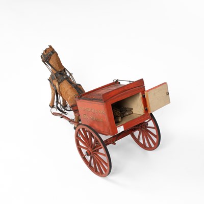 Lot 34 - A model of a W. H. Smith & Son branded horse drawn cart