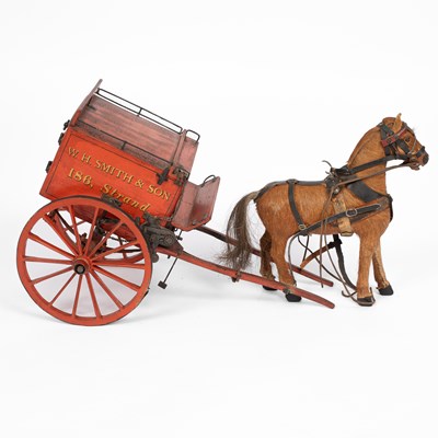 Lot 34 - A model of a W. H. Smith & Son branded horse drawn cart