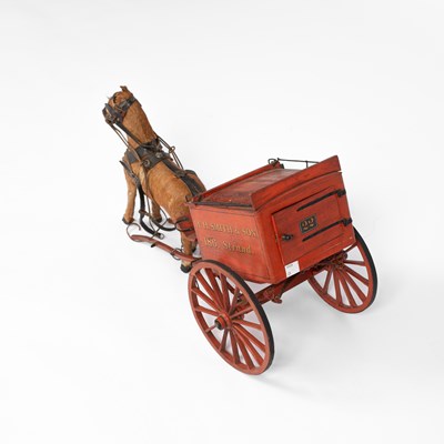 Lot 34 - A model of a W. H. Smith & Son branded horse drawn cart