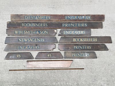 Lot 62 - A collection of W. H. Smith in-store category signs in relief