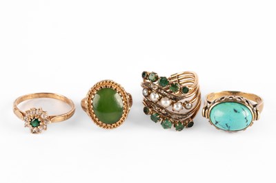 Lot 284 - Four yellow metal gem set dress rings