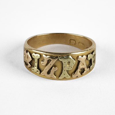 Lot 84 - An 18ct bi-colour gold Mizpah ring