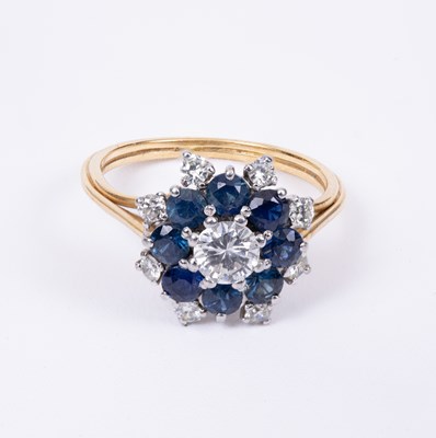 Lot 94 - A diamond and sapphire cluster ring