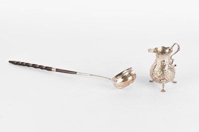 Lot 111 - A Georgian silver toddy ladle