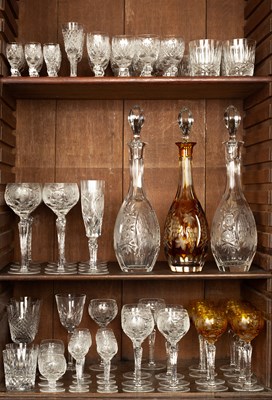 Lot 876 - A suite of clear and amber glass decanters and drinking glasses