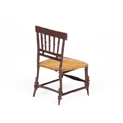 Lot 446 - An English cast pewter dolls' house chair