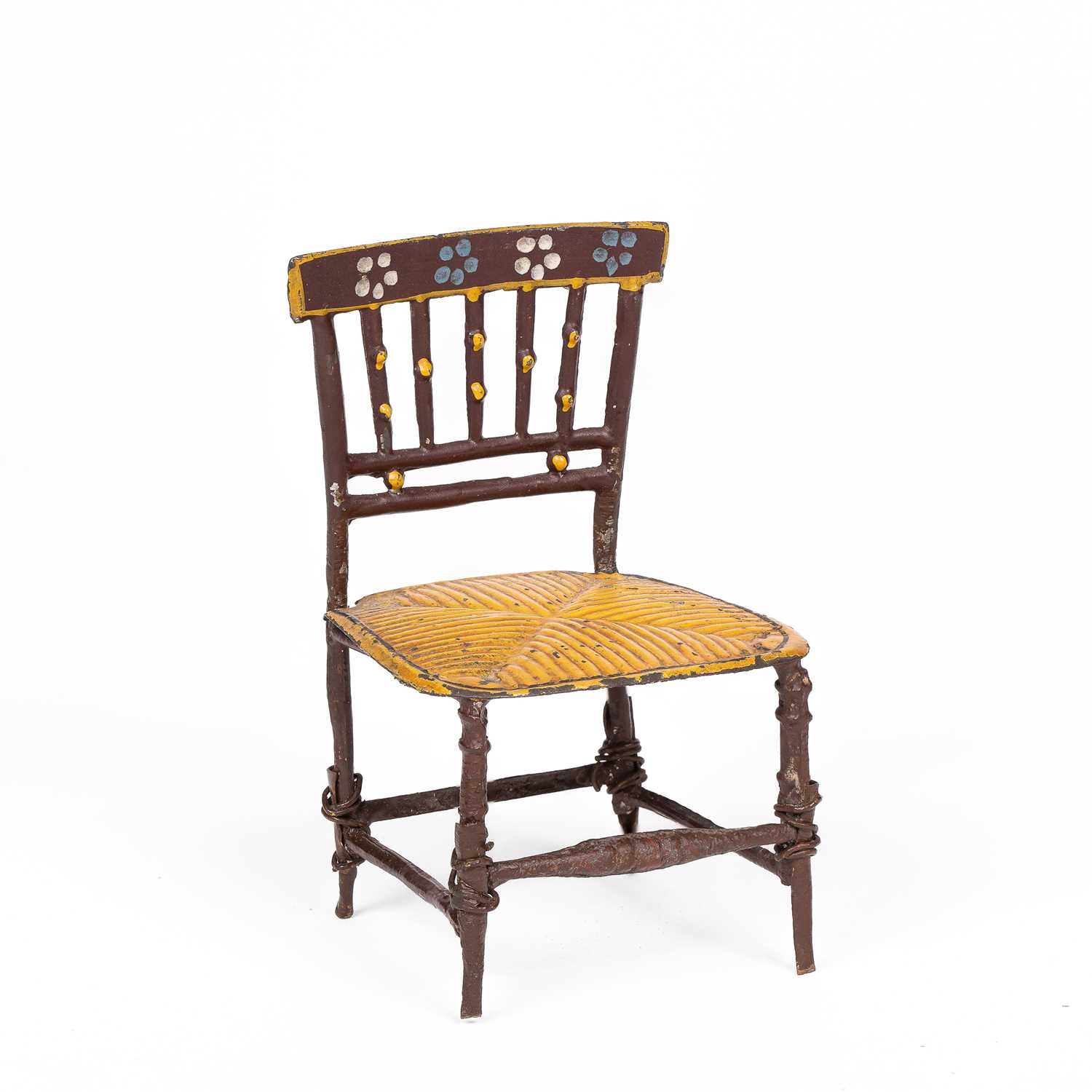 Lot 446 - An English cast pewter dolls' house chair