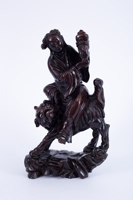 Lot 235 - A Chinese root wood figure of a deity