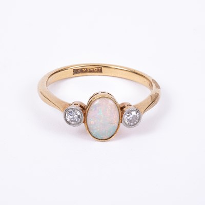 Lot 104 - An opal and diamond dress ring