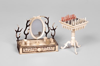 Lot 458 - A German bone dolls' house chess table and a dressing table