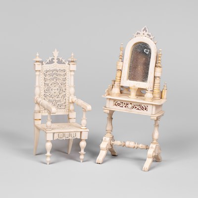 Lot 459 - A German bone dolls' house dressing table and chair